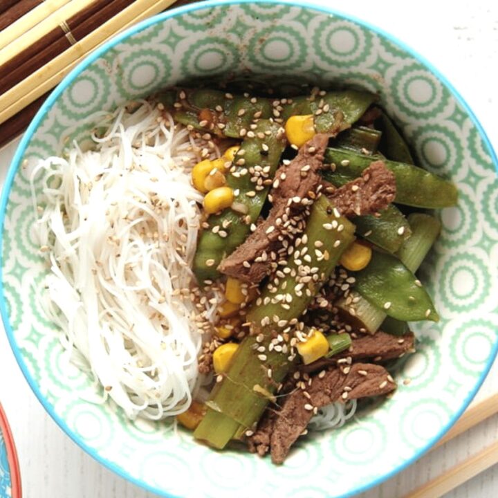 rice noodle bowl with ginger and green onions beef.