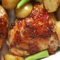 sticky glazed baked mango chicken close up