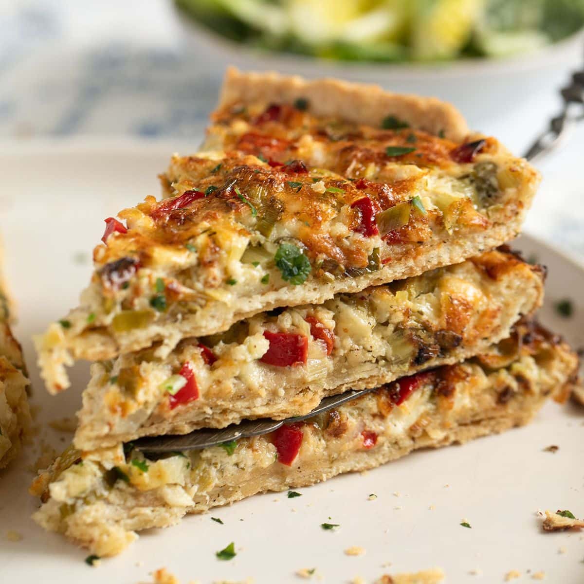 three slices of green onion quiche.