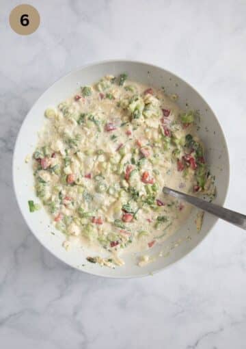 mixture of ingredients for filling quich with green onions, peppers and sour cream.