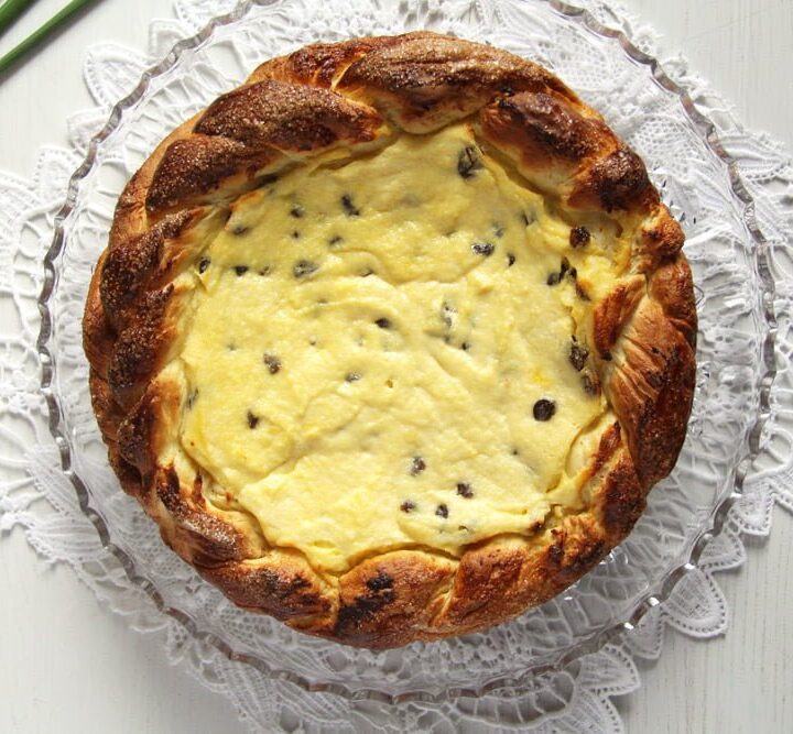 round easter cheesecake with raisins on a platter