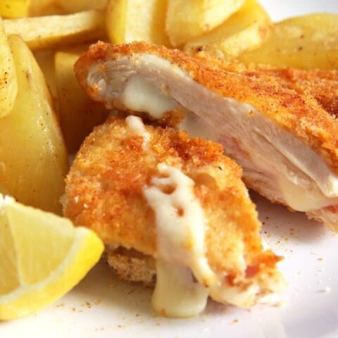 cheese oozing from stuffed chicken breast.