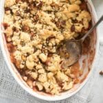 close up rhubarb and apple crumble with crispy topping.