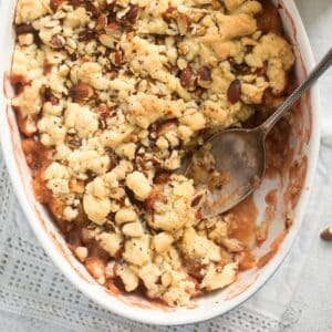 close up rhubarb and apple crumble with crispy topping.
