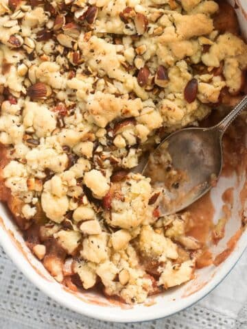 close up rhubarb and apple crumble with crispy topping.