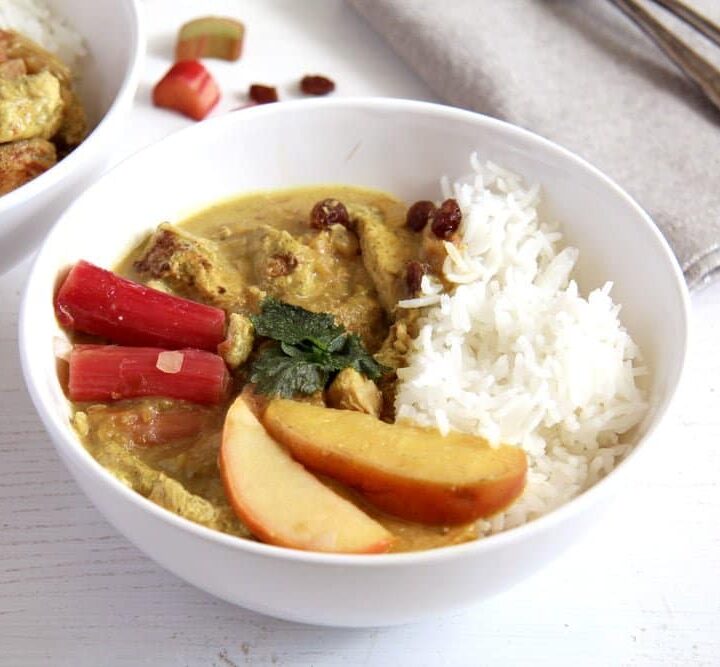 rhubarb chicken curry in a white bowl on the table