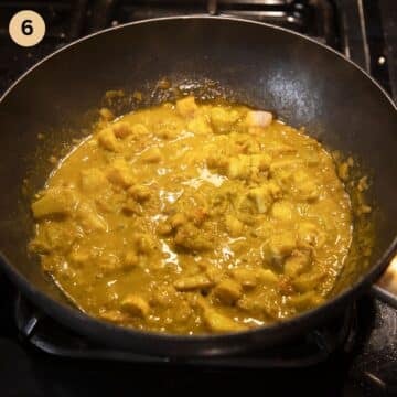 simmering curry with fish and bananas.