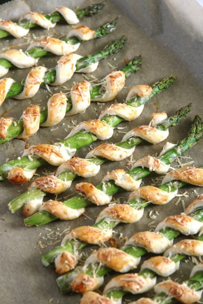 asparagus puff pastry twists on a baking tray