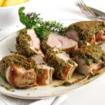 pistachio crusted pork tenderloin slightly pink in the middle