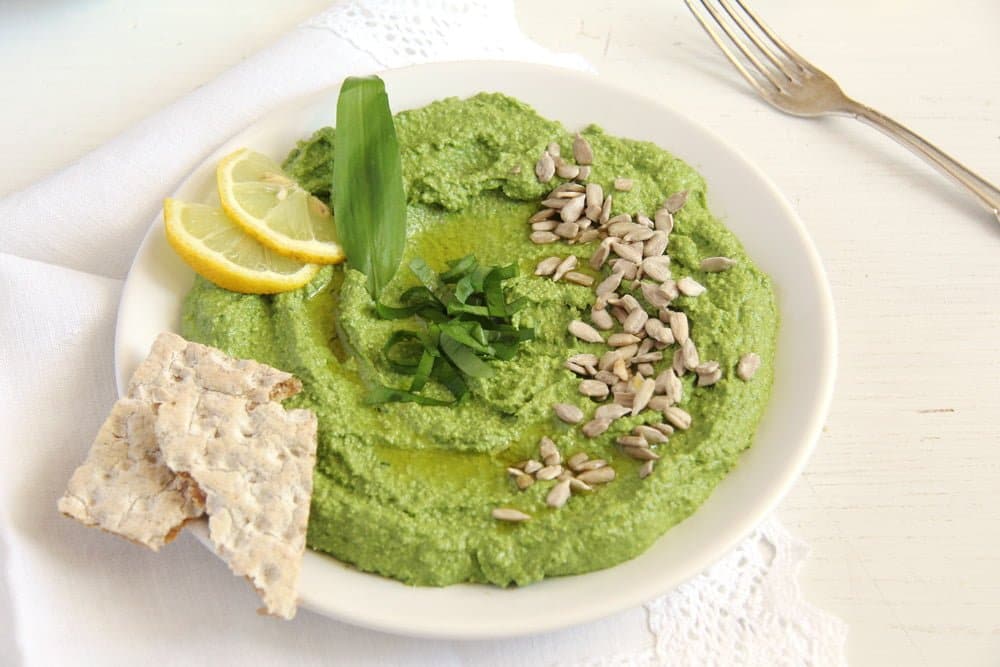 full plate of very green spread with wild garlic and sunflower seeds