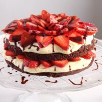 strawberry torte on a platter with chocolate glaze close up.