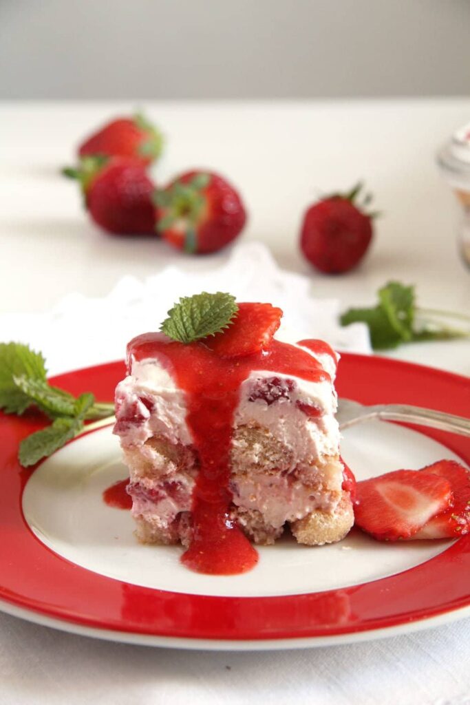 strawberry tiramisu dessert with sauce and ladyfingers