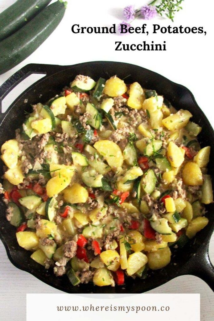 ground beef, potatoes and zucchini in a skillet