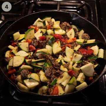 adding chopped zucchini and peppers to ground beef in a skillet.