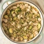 israeli couscous with chicken in a pot.