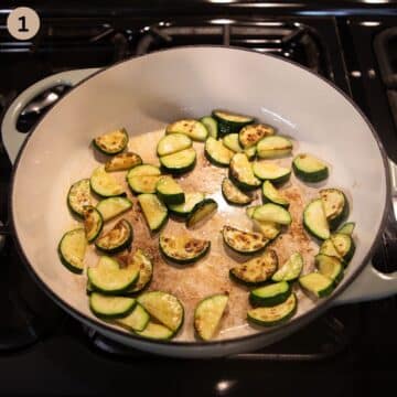 cooking sliced zucchini in a large dutch oven.