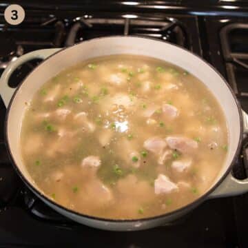 adding stock to a pot with couscous and chicken.