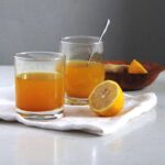 ginger turmeric tea in cups pinterest image with title.
