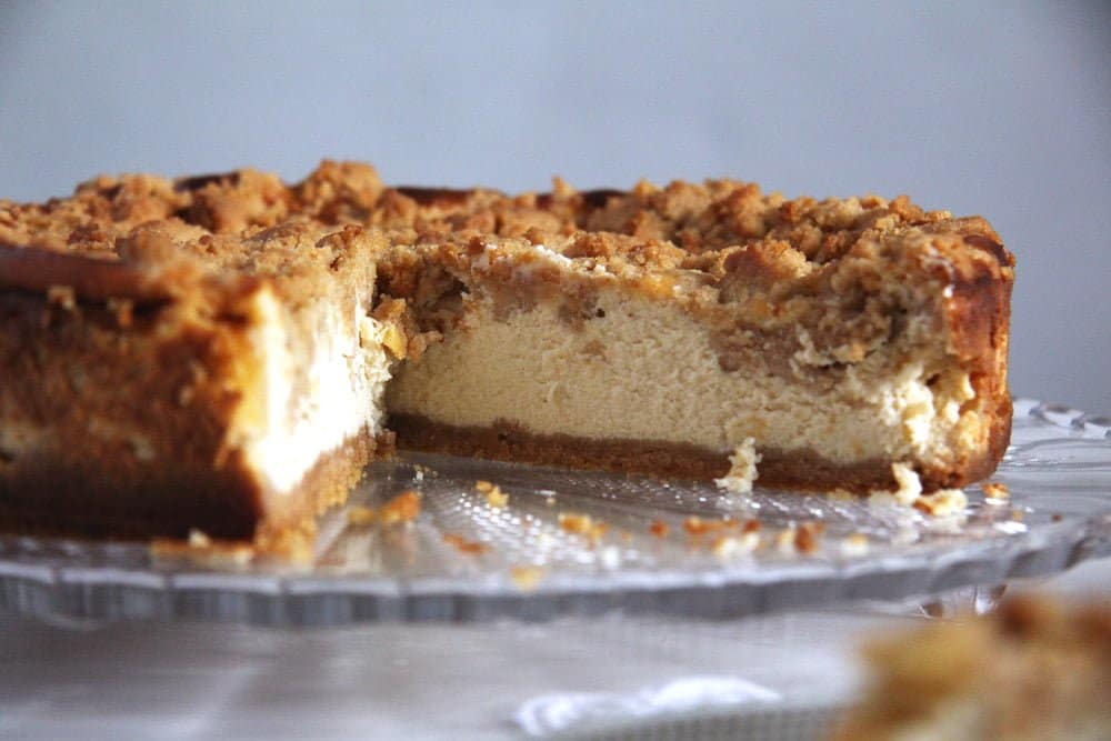 apple streusel cheesecake cut in the middle