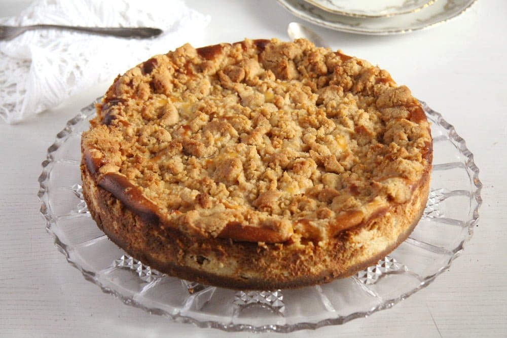 apple crumb cheesecake on a platter