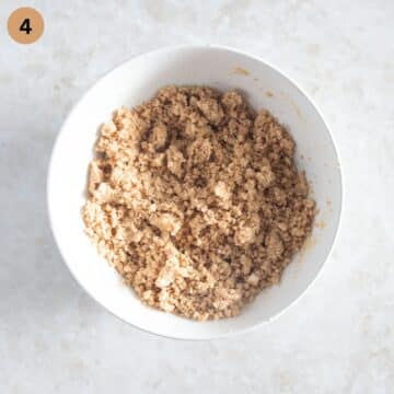 streusel for apple cheesecake in a bowl.