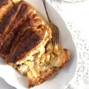 pull-apart apple yeast bread on a cake platter.