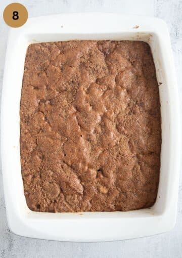 baked brown sugar cake with cinnamon sugar topping in a ceramic baking dish.