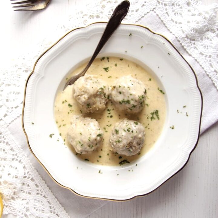 konigsberger klopse in white sauce with capers in a vintage plate