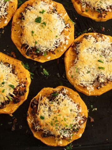 roasted butternut squash slices topped with mushrooms and parmesan.