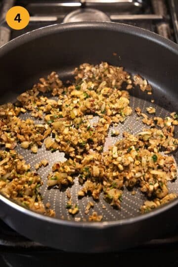 sauteing finely chopped mushrooms and onions in a skillet.