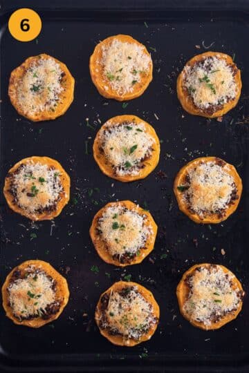 baked butternut squash rounds topped with panko, mushrooms and parmesan on a baking sheet.