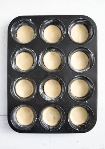 pastry rounds in the moulds of a muffin pan.