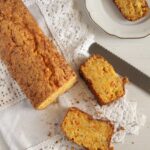 sliced pumpkin bread with almonds on a vintange white cloth