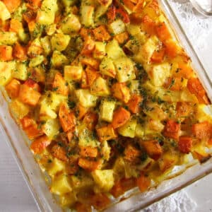 pumpkin potato bake in a glass casserole dish.