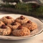 german hazelnut macaroons on a small vintage plate close up.