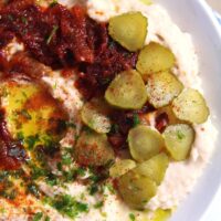 fasole facaluita bean dip in a white bowl