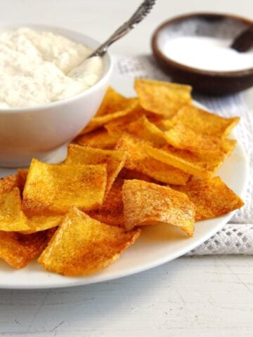 Polenta chips with a bowl of dip.