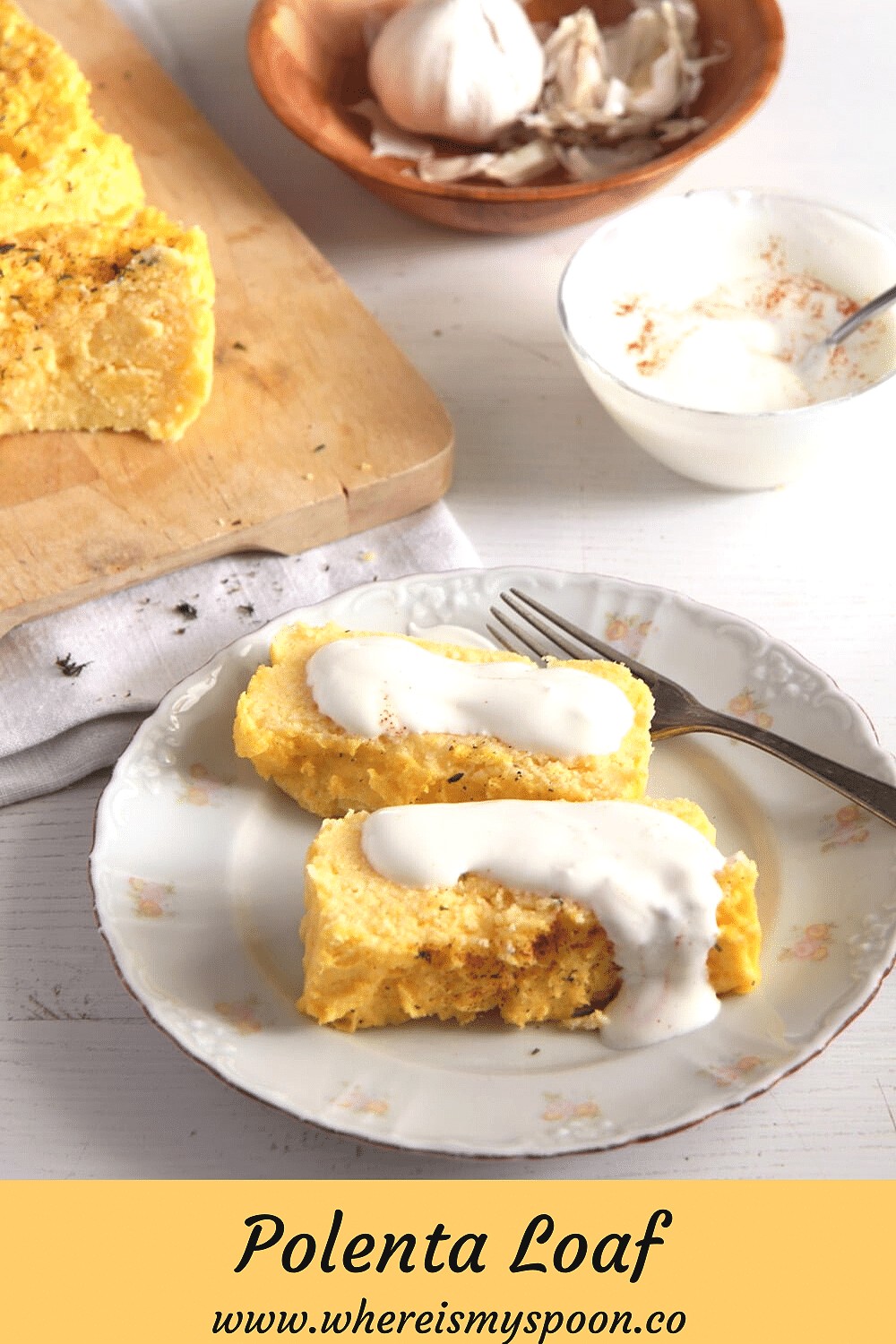 two slices of baked polenta served with yogurt sauce