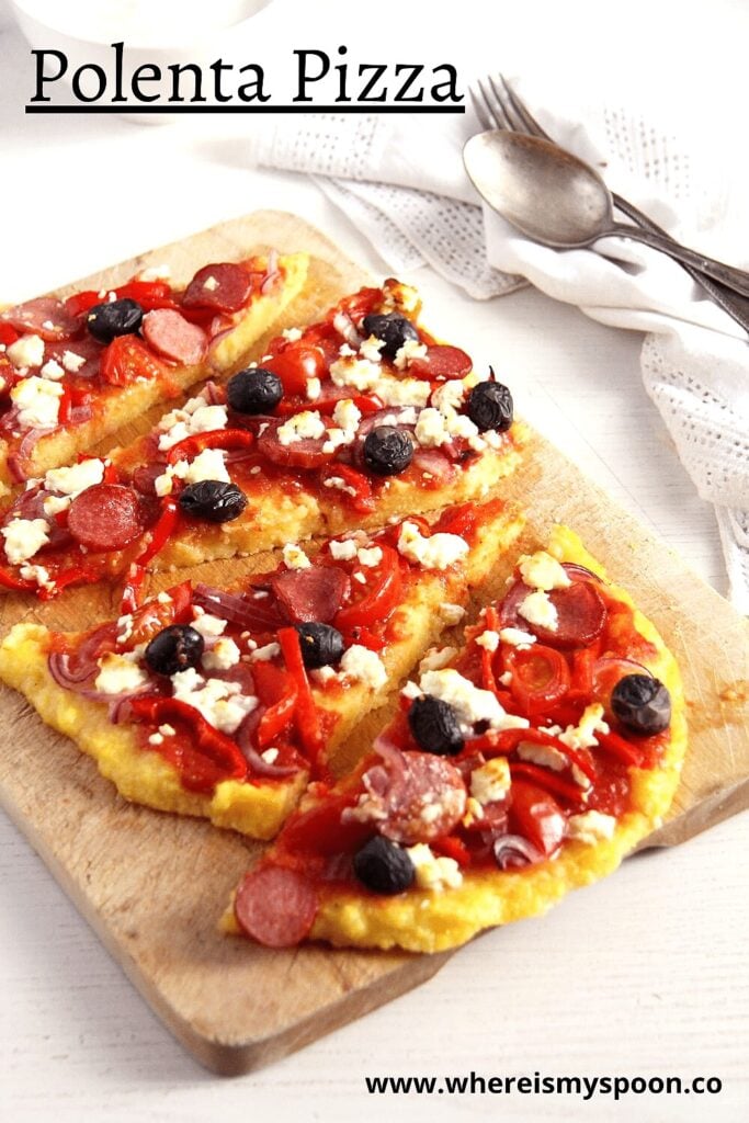 cornmeal pizza topped with sausage, cheese and olives