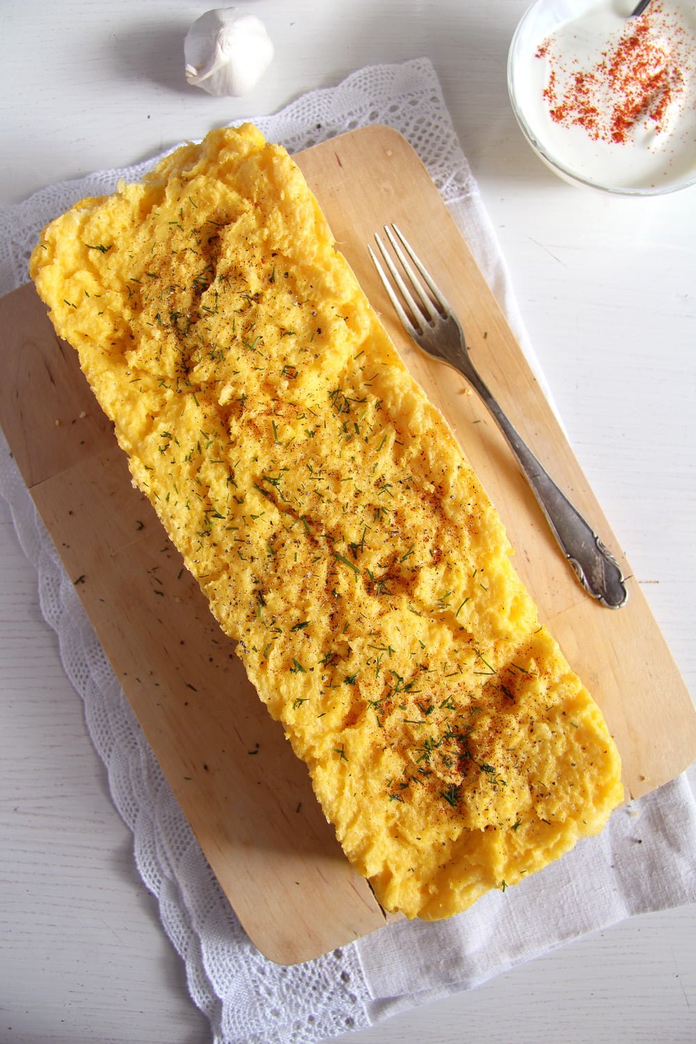 loaf of cornmeal bake on a wooden board