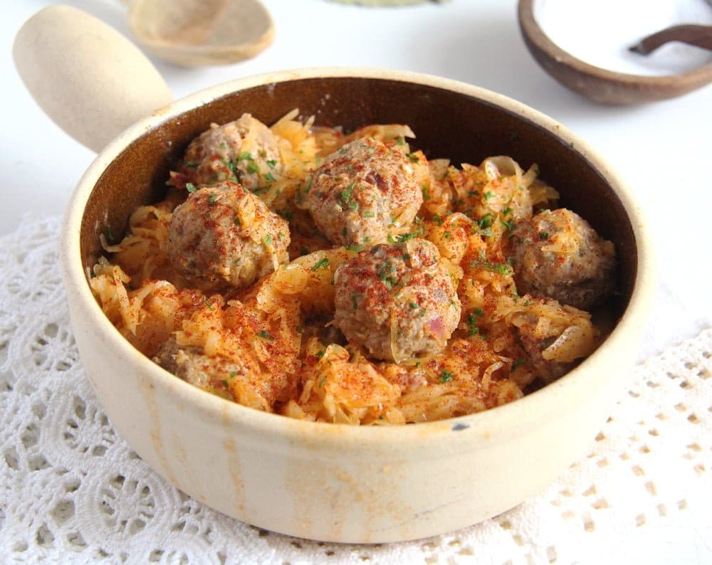 stew with meatballs and sauerkraut on the table