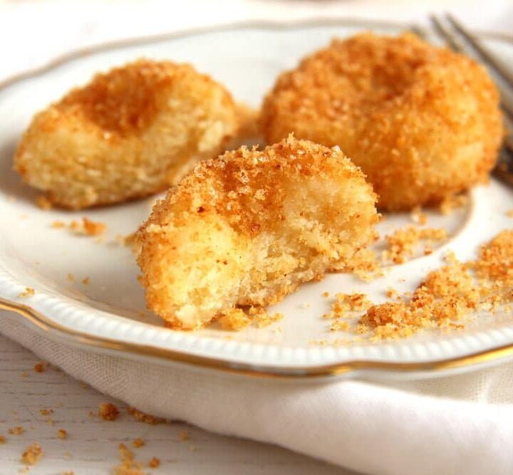 soft dumplings coated with breadcrumbs on a plate