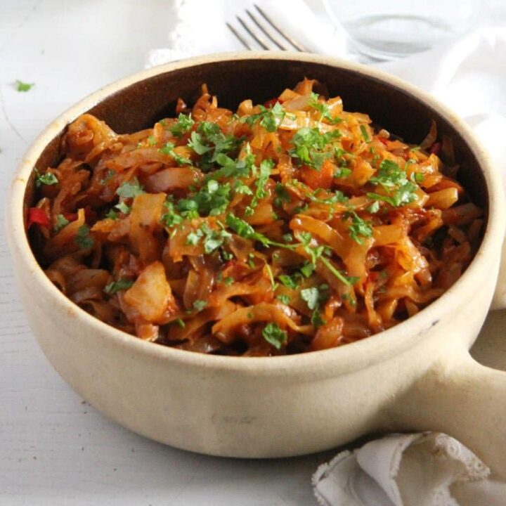 romanian stew with cabbage in a pot.
