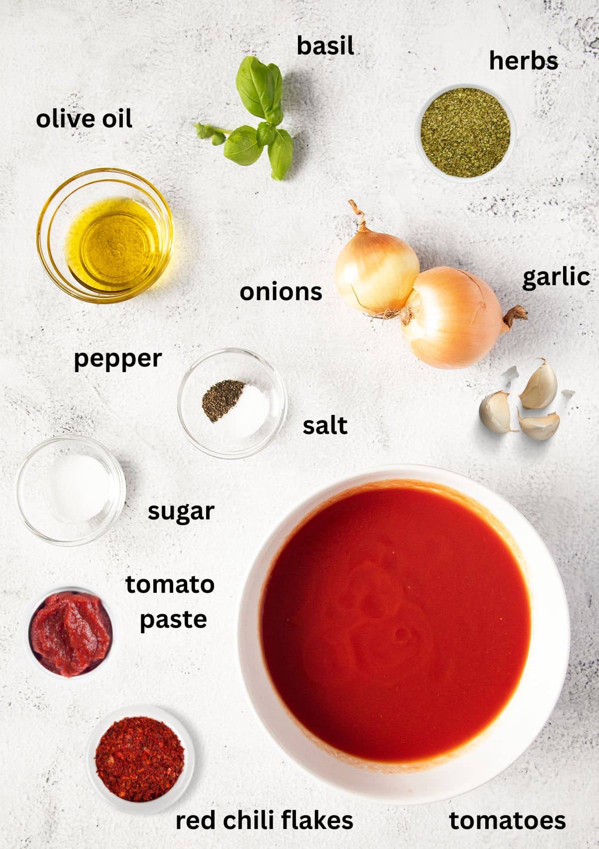 labeled ingredients for making marinara sauce on the table.