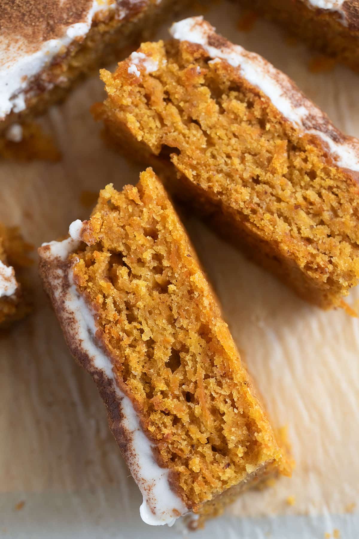 slices of carrot cake showing the crumb.