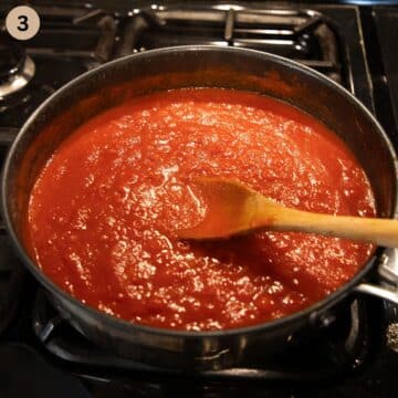 stirring spicy marinara sauce with a wooden spoon on the stovetop.