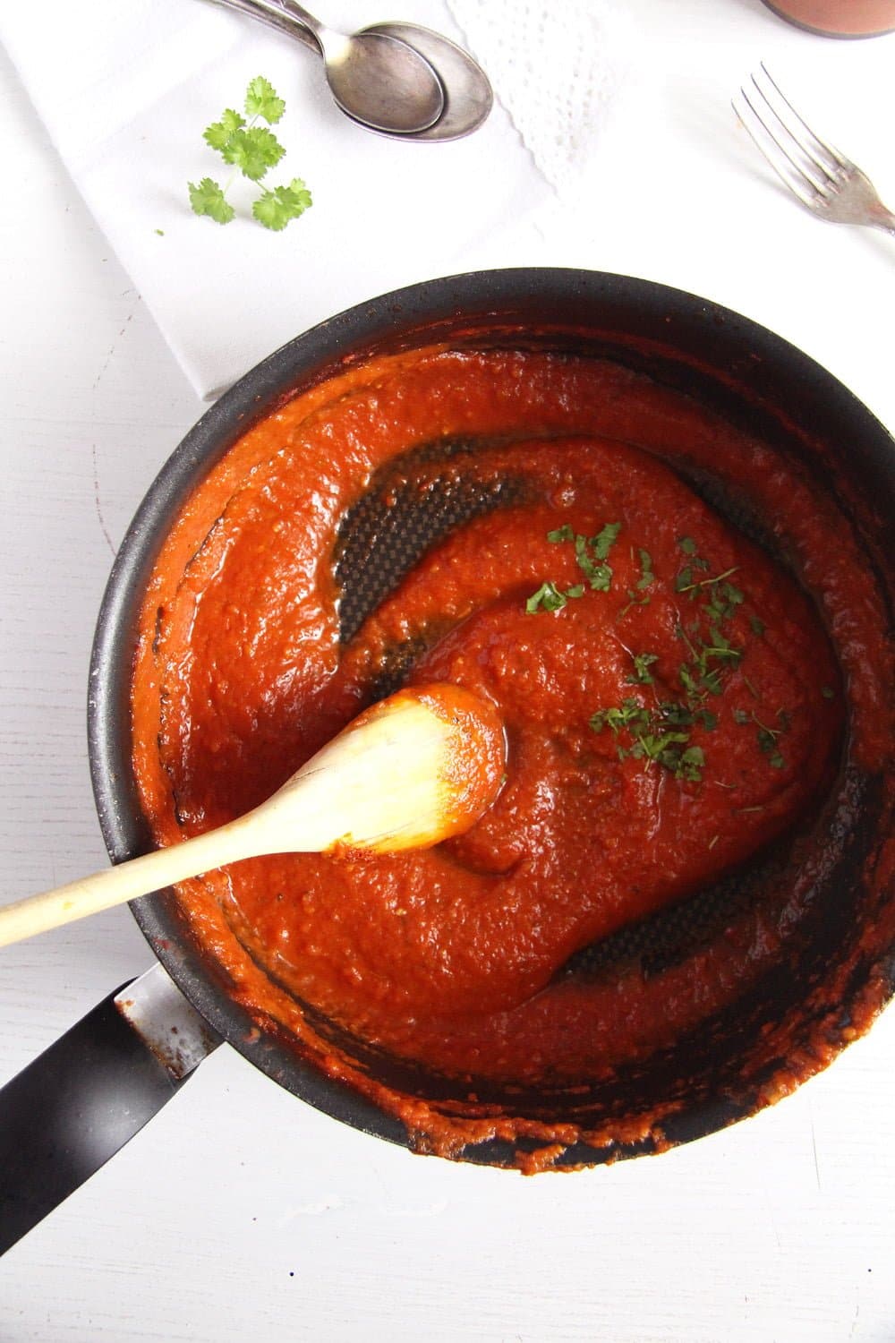 spicy marinara sauce cooked in a black saucepan