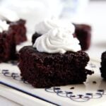 small cocoa brownies with coconut cream topping