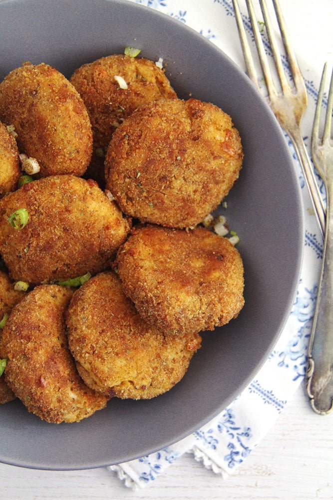 baked cauliflower patties crispy on the outside served in a bowl