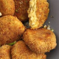 golden and crispy potato cauliflower patties close up